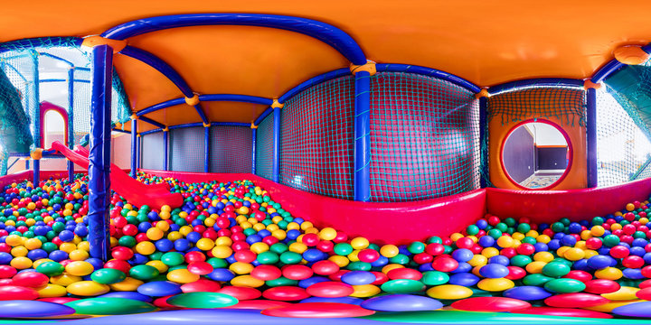 children's playroom with colorful balls and a slide made of plastic. Spherical panorama 360vr