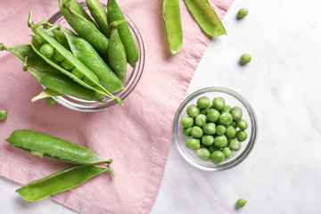 Composition with tasty fresh peas on light background