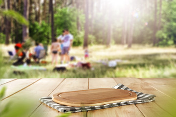 Desk of free space and summer garden background 