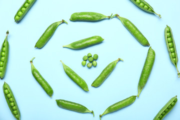 Tasty fresh peas on color background