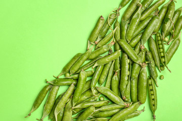 Tasty fresh peas on color background