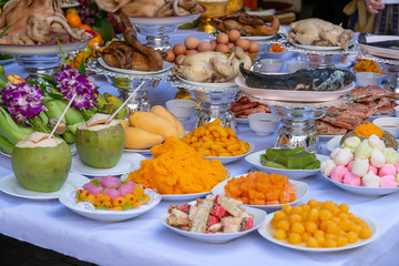 Sacrificial offering food for pray to god and memorial to ancestor, Bangkok, Thailand. Traditional offerings to gods with food, vegetable and fruit for the gods of Thai culture