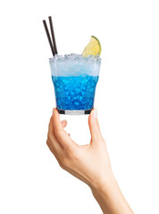 Woman hand holding cocktail glass with ice cubes on white background.