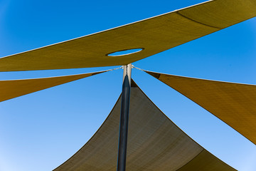 Shade Sail Color brown roof from the sun on the playground boat, coast,