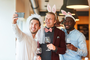 Friends make selfie at bachelor party - obrazy, fototapety, plakaty