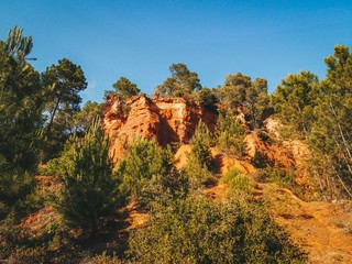 Ochre trail in Roussillon in France, orange stones