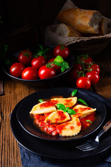 ravioli alla genovese with basil tomato sauce
