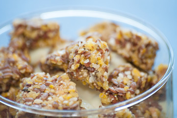 Granola with Greek yogurt in a glass beaker, close-up macro. Healthy and natural food, delicious breakfast.
