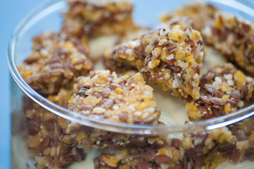 Granola with Greek yogurt in a glass beaker, close-up macro. Healthy and natural food, delicious breakfast.