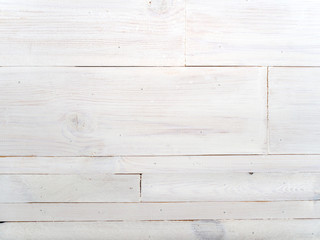 Naklejka premium Wooden table made of various sizes boards painted in white. Background with horizontal lines