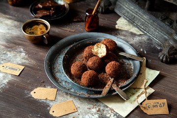 homemade truffle candy in two metal vintage plates with chocolate flakes