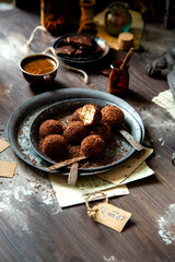 homemade truffle candy in two metal vintage plates with chocolate flakes
