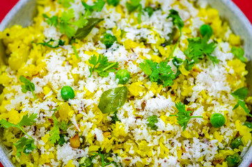 Detail shot of Poha - a North Indian Breakfast dish. Made of flattened rice, potatoes and coconut.