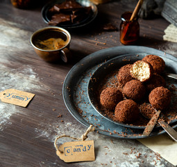 homemade truffle candy in two metal vintage plates with chocolate flakes