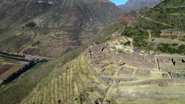 Aerial view of the ancient Inca ruins of Pisac (Pisaq) in the Sacred Valley near Cusco, Peru. Archaeological park with green terraces.