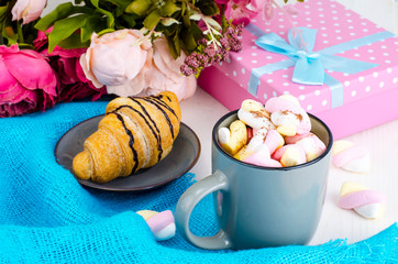 Romantic breakfast with marshmallows and croissant