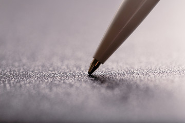 white automatic plastic ballpoint pen with clipping path on black background. close up.