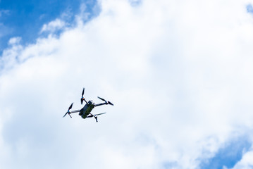Flying video drone on blue sky