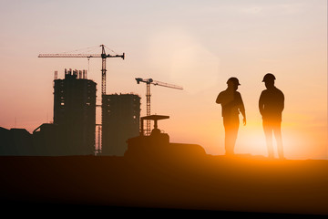 Fototapeta na wymiar Silhouette of engineer and construction team working at site over blurred background for industry background with Light fair.Create from multiple reference images together
