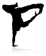 A male street dance hip hop dancer in silhouette