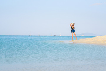 Fototapeta na wymiar Portrait of young pretty woman at the turquoise sea beach, Lipe island, Thailand