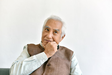 Confusing and forgetful elderly asian man with thinking gesture, Alzheimer's disease, Dementia cognitive brain problem in old pensioner, Senior healthcare concept.