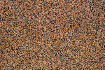 Brown concrete texture with small pebbles