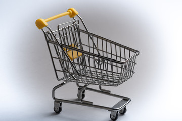 Close-up of shopping carts on white background.Trolley, Sale concept.Empty grocery shopping cart. Isolated over white background.