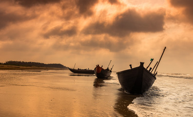 Silhouette Boats anchored on the sea Beach at Digha beach.