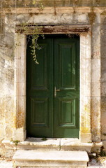 Fototapeta na wymiar old wooden door in a Greek village