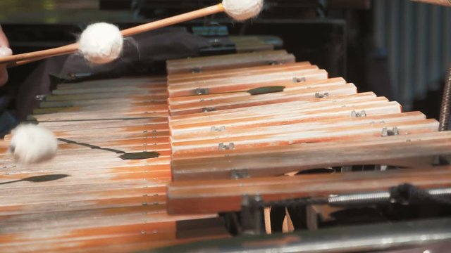 Hands of musician playing the vibraphone on the street. Music Instrument Vibraphone close up.