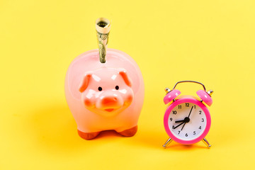 time save concept. retirement. family budget. time is money. Economy and budget increase. success in finance and commerce. business startup. financial position. piggy bank with alarm clock. Moneybox