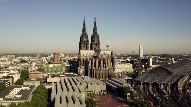 The cathedral in Cologne callend Dom zu K&ouml;ln. The drone is rising into the sky showing the architecture in the city center of the capital or NRW, Germany.