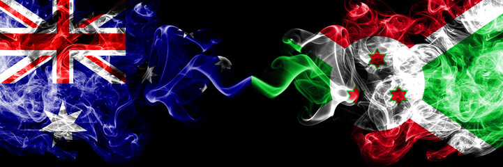 Australia vs Burundi, Burundian smoky mystic flags placed side by side. Thick colored silky smokes combination of national flags of Australia and Burundi, Burundian