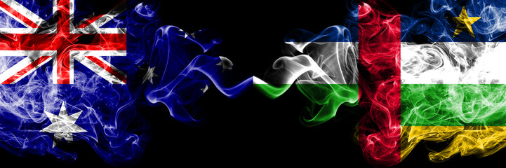 Australia vs Central African Republic smoky mystic flags placed side by side. Thick colored silky smokes combination of national flags of Australia and Central African Republic