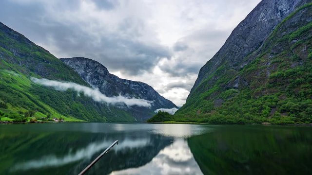 View of clouds forming over N&aelig;r&oslash;yfjord on a summer morning.