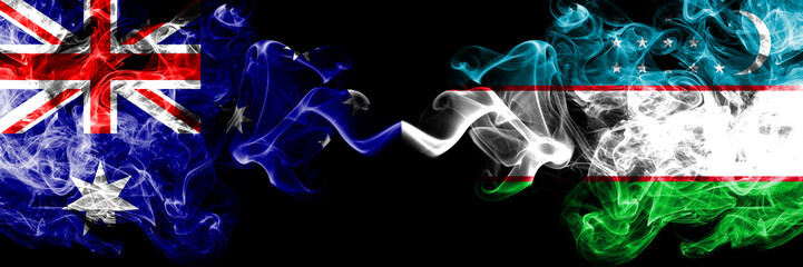 Australia vs Uzbekistan, Uzbek smoky mystic flags placed side by side. Thick colored silky smokes combination of national flags of Australia and Uzbekistan, Uzbek
