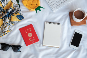Flat lay with travel accessories, passport, phone, colored pencil on white background in Autumn. Travel and outdoor.