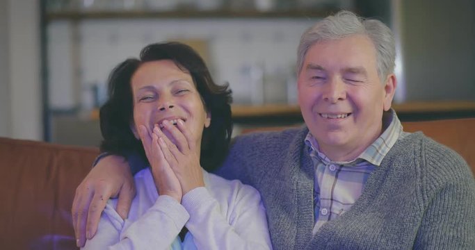 Elderly Couple Watching Funny Tv Show