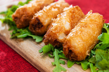 pork spring rolls Rice cakes stuffed with a pork stuffing accompanied by sauce
