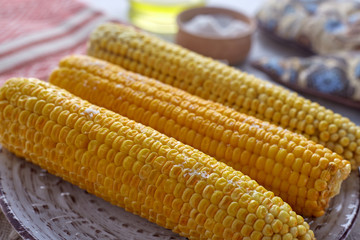 Boiled corn with olive oil and solt