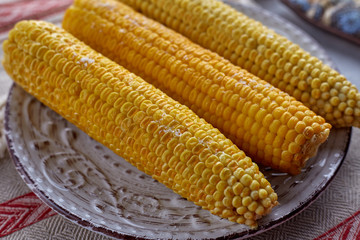 Boiled corn with olive oil and solt