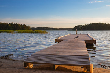 A seagull squawks on a dock in the Archipelago of Finland during summer. 