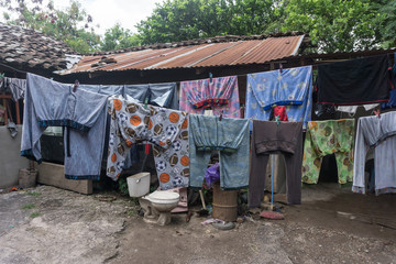 Fototapeta na wymiar Clothes hanging in a poor house on Nicaragua. Travel general imagery