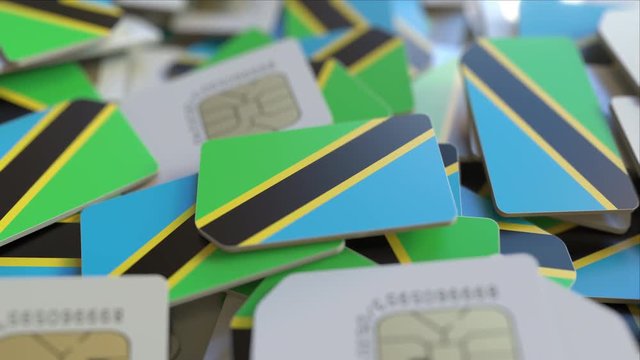 Many SIM cards with flag of Tanzania. Tanzanian mobile telecommunications related 3D animation