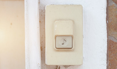 Door bell button at the front door.