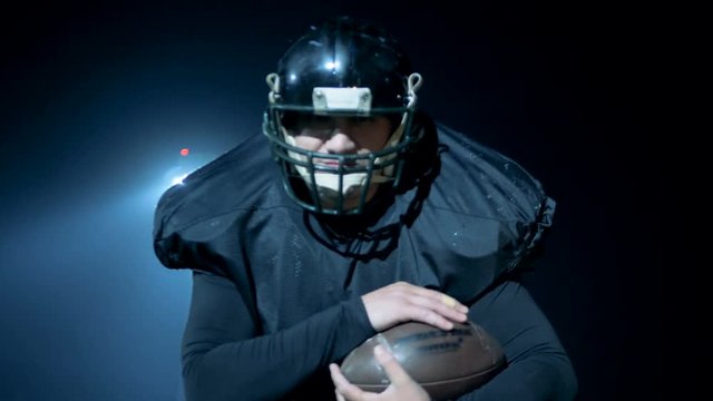 American football player is getting ready to throw the ball