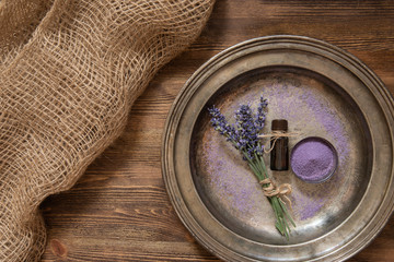 Lavender, bath salt and lavender oil on an old metal plate.