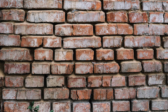 old red brick wall, cracked brickwork texture