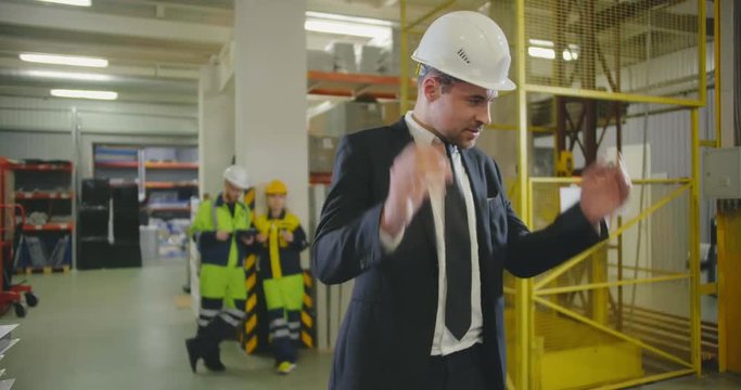 Exhausted businessman ar factory